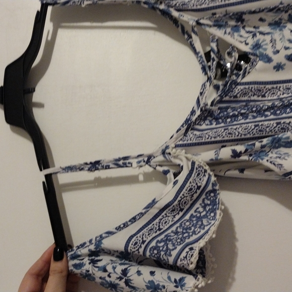 Super cute top with cold shoulder, flutter sleeves and lace-up neckline! - Picture 3 of 3